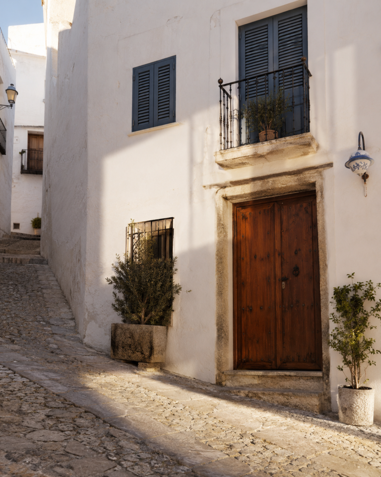 Traditional house entrance and steep stone street in Altea Old Town